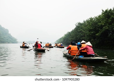 Tourism Groups With Boat Paddle Go By The River. Flanked Trees Both Sides Of The Canal Paddle Into Mist. Concept Promote Love Nature And Happiness.