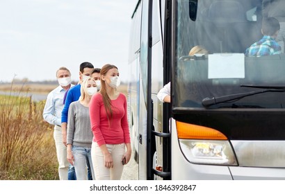 Tourism And Health Concept - Group Of Passengers Wearing Face Protective Medical Mask For Protection From Virus Disease Boarding Travel Bus