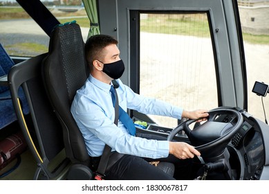 Tourism, Health And People Concept - Male Driver Wearing Face Protective Black Mask For Protection From Virus Disease Driving Intercity Bus