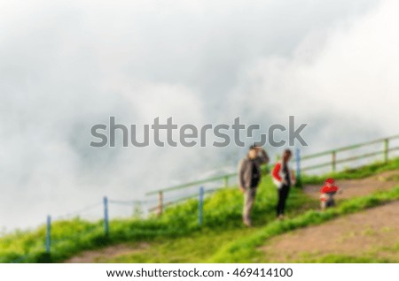 Tourism landscape background with traveling parents. Blurred image of the traveler. 