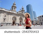 Tourism in Santiago de Chile. Traveler girl visiting Plaza de Armas main square of Santiago de Chile, South America.