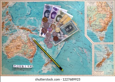 Tourism Scrabble Letters And Moneys Lying On The Map                               