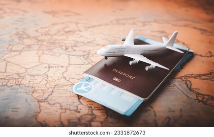 tourism travel concept, plane over a passport and a map - Shutterstock ID 2331872673