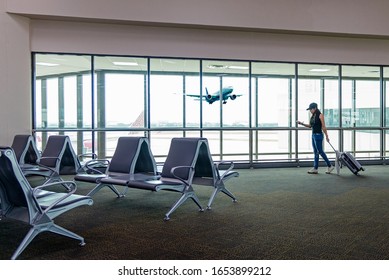 Tourism woman planning trip travel checking board pass at airport and airliner. People tourist hold bag near lounge in hall airplane. Travel  Concept - Shutterstock ID 1653899212
