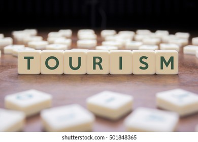 TOURISM word on block concept - Shutterstock ID 501848365