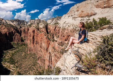 Tourist With Backpack Hiking In Zion National Park, Utah, USA