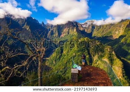 Tourist at the Balcoes viewpoint over the Valley of the Ribeira da Metade, Madeira Island, Portugal