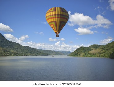 Tourist balloons, balloons floating over the Mekong River in Lao PDR, balloons floating in a beautiful blue sky, balloon group, focus in the upper left corner of the  image, focus in the upper right  - Shutterstock ID 2239608759