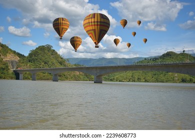Tourist balloons, balloons floating over the Mekong River in Lao PDR, balloons floating in a beautiful blue sky, balloon group, focus in the upper left corner of the  image, focus in the upper right  - Shutterstock ID 2239608773