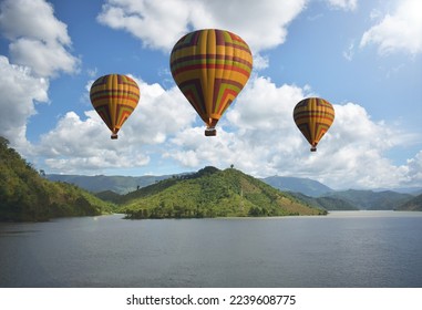 Tourist balloons, balloons floating over the Mekong River in Lao PDR, balloons floating in a beautiful blue sky, balloon group, focus in the upper left corner of the  image, focus in the upper right  - Shutterstock ID 2239608775