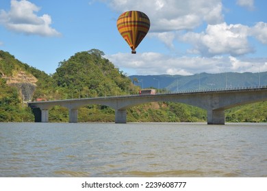 Tourist balloons, balloons floating over the Mekong River in Lao PDR, balloons floating in a beautiful blue sky, balloon group, focus in the upper left corner of the  image, focus in the upper right  - Shutterstock ID 2239608777