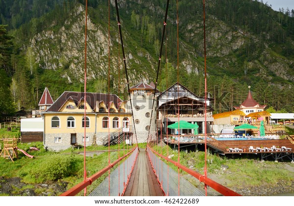 Tourist base in the Altai mountains,\
the view from the pedestrian bridge over the Katun\
river