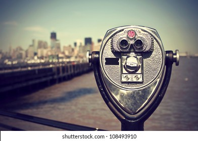 tourist binoculars at Liberty Island in front of Manhattan Skyline, vintage style, New York City, USA