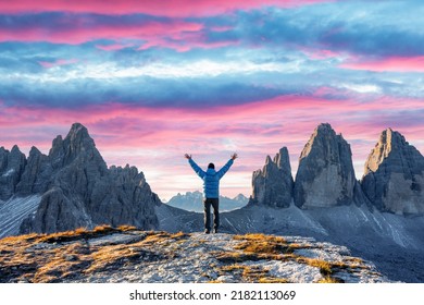 Tourist in blue jacket at Three Peaks of Lavaredo track on autumn season. National Park Tre Cime di Lavaredo, Dolomite Alps mountains, Trentino Alto Adige region, Sudtirol, Dolomites, Italy - Shutterstock ID 2182113069