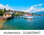 Tourist boat in Lugano lake and Lugano city in canton of Ticino in Switzerland