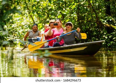 tourist boat navigating on murky amazonian water in cuyabeno wildlife reserve raft tour wildlife drive amazon tourist rafting water white team vacation nature outdoor adventure female river challenge