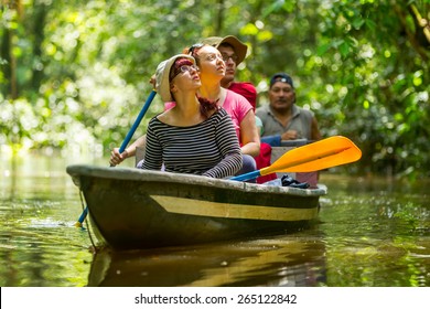 Tourist Boat Navigating On Murky Amazon Water In Cuyabeno Wildlife Reserve - Shutterstock ID 265122842