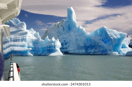 Tourist boat near the Icebergs from Upsala Glacier in the Argentino Lake, Argentina. Argentino Lake is the biggest freshwater lake in Argentina. - Powered by Shutterstock