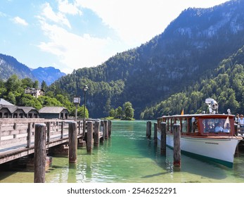 Tourist boat at pier on Lake Königssee in Bavarian Alps in a beautiful summer day - Powered by Shutterstock