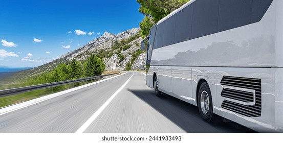 Tourist bus on a mountain road by the sea. Tourist travel concept.