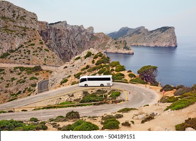 Tourist bus on the mountain road of the Cape Formentor as seen from the Formentor lighthouse. Island Majorca, Spain. - Shutterstock ID 504189151