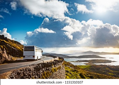 Tourist bus traveling on mountain road. Ring of Kerry, Ireland. Travel destination