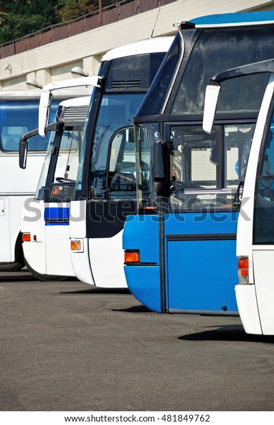 Tourist buses at the bus station\
expect passengers, people travel and transportation\
concept