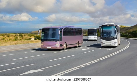 Tourist Buses Moving On A Wide Country Highway