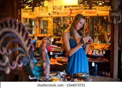 Tourist Chooses Souvenirs In A Shop