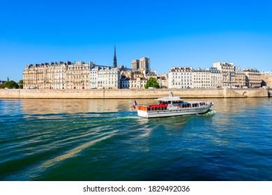 Tourist City Tour Boat On The Seine River In Paris In France