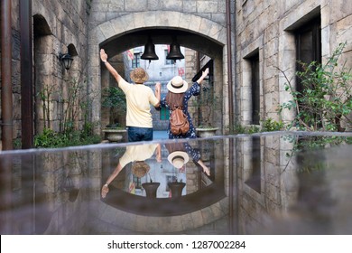 Tourist couple are enjoy traveling at French village on Bana hill in Danang, Vietnam.