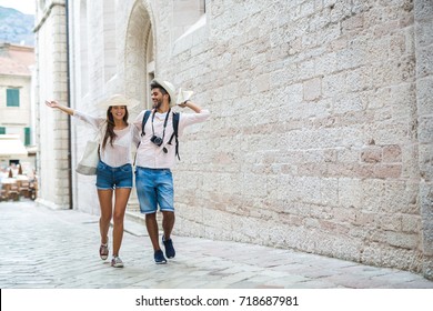 Tourist Couple Enjoying Sightseeing And Exploring City