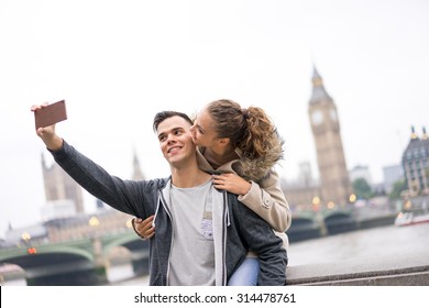 Tourist Couple Taking Selfie At Big Ben, London