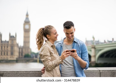 Tourist Couple Taking Selfie At Big Ben, London