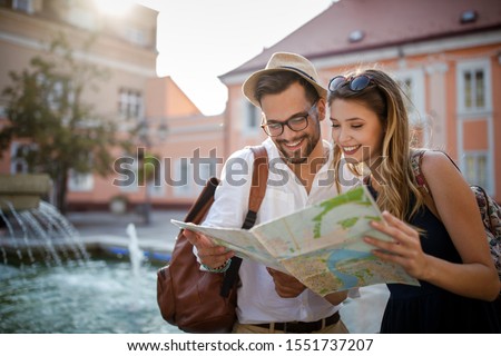 Tourist couple traveling. Travel. Walking on street. Portrait of beautiful young people
