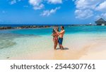 Tourist couple with young child in Curaçao, an island in the Caribbean Sea