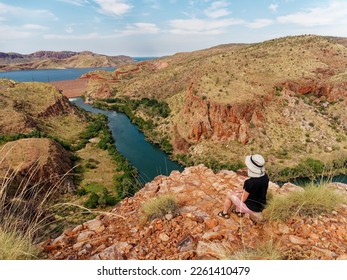 Tourist enjoying the view at the Ord River Gorge lookout is a 30 minute walk from the Lake Argyle tourist Village.
Kimberley region of North West Western Australia.