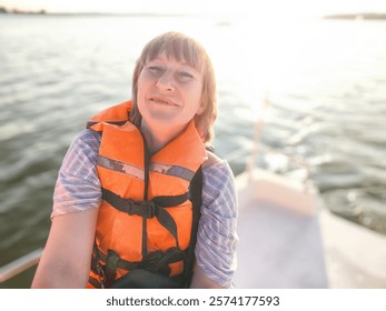 A tourist enjoys taking selfies on a boat while wearing a life jacket, capturing the joyful moment on a sunny day by the water