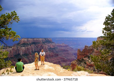 Tourist Family In Grand Canyon - North Rim