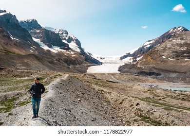 Tourist at the famous Athabasca Glacier in Jasper National Park, Canadian Rockies, Alberta, Canada. 