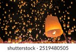 Tourist floating sky lanterns in Loy Krathong festival , Chiang Mai ,Thailand.