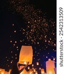 Tourist floating sky lanterns in Loy Krathong festival , Chiang Mai ,Thailand.