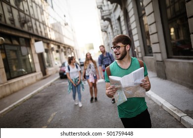 Tourist Friends Traveling And Exploring City