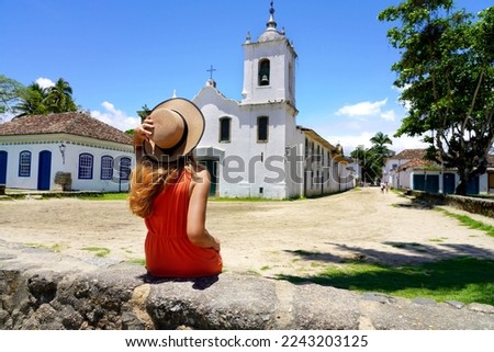 Tourist girl in Paraty historic cultural town in Rio de Janeiro State, Brazil