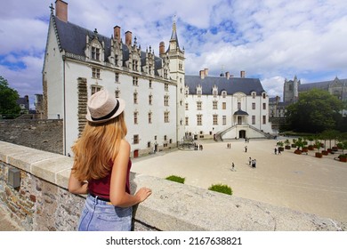 Tourist Girl Visiting The Château Des Ducs De Bretagne A Large Castle In The City Of Nantes, France