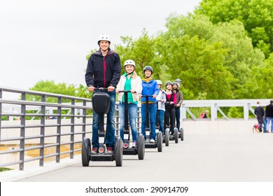 Tourist Group Having Guided Segway City Tour In Germany