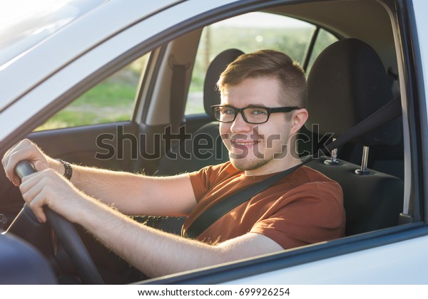 Tourist\
guy in car. Travel and summer vacation\
concepts.