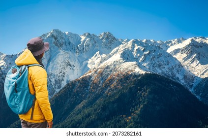 Tourist hiker enjoy view of the majestic Himalaya mountain range of Kailash at Kalpa Himachal Pradesh, India