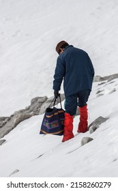 Tourist Hiking On Jade Dragon Snow Mountain, Lijiang, Yunnan Province, Southern China