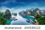 Tourist junks floating among limestone rocks at Ha Long Bay, South China Sea, Vietnam, Southeast Asia